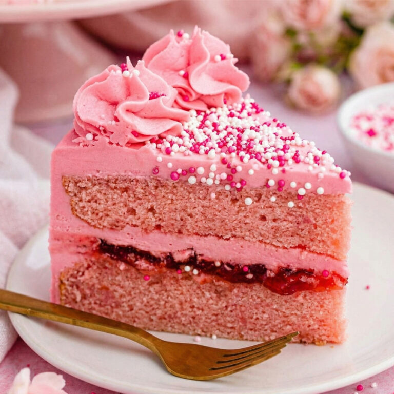 pink velvet cake slice with raspberry filling
