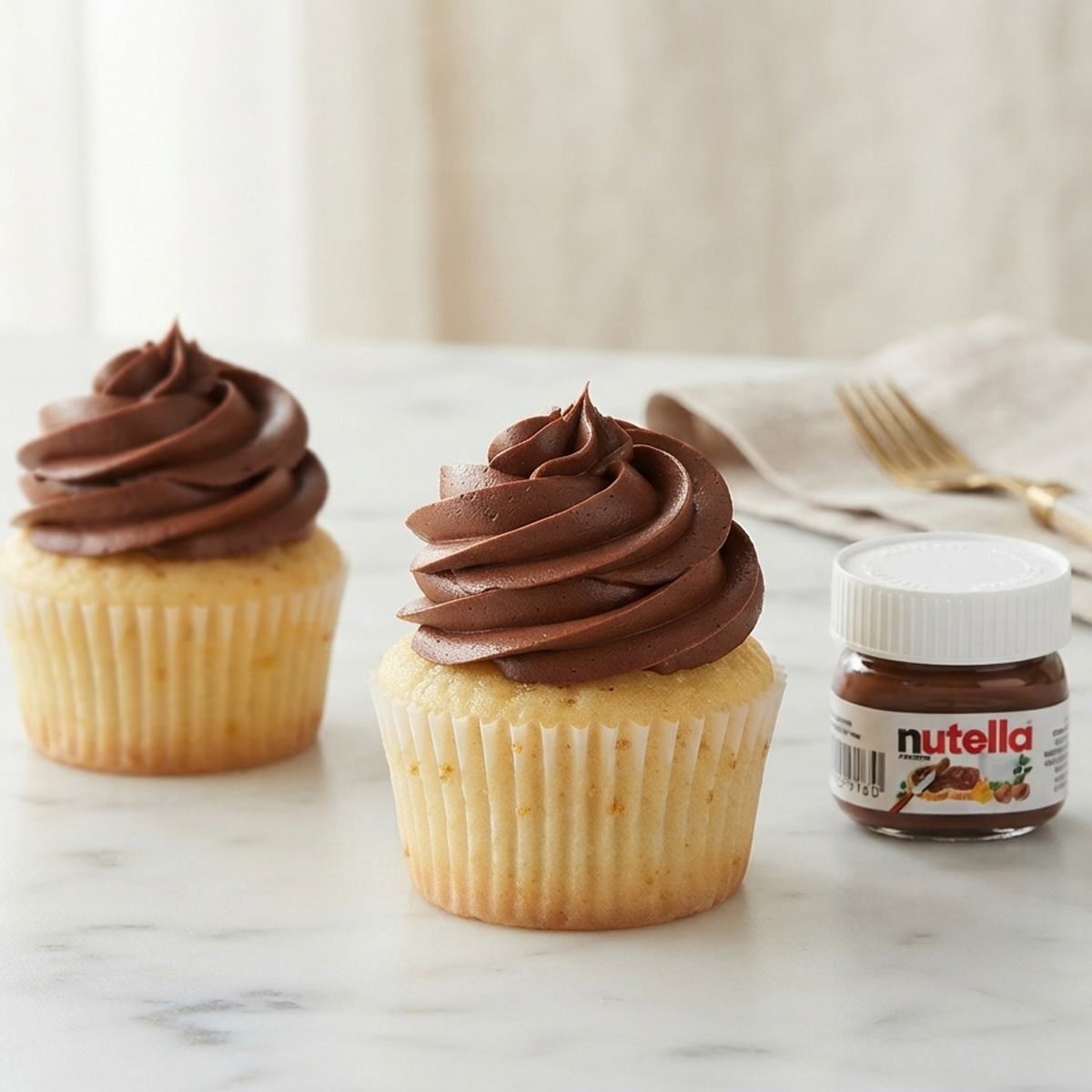 Whisking the Ganache A wire whisk stirring hot cream into thick Nutella in a glass bowl to create a smooth ganache.